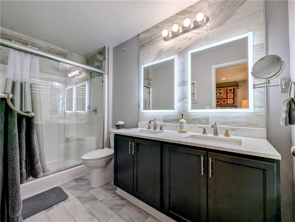 146 Rylie Drive Harmony, PA 16037 - Photo 28 of 43 a bathroom with a double vanity sink toilet mirror and shower