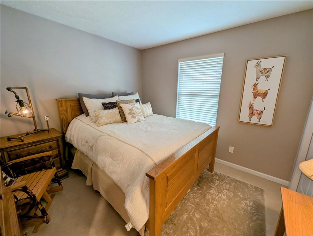 146 Rylie Drive Harmony, PA 16037 - Photo 30 of 43 a bedroom with a bed and a chandelier