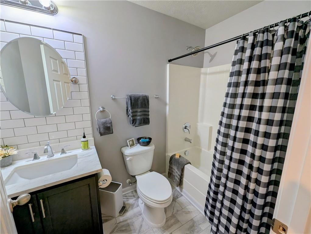 146 Rylie Drive Harmony, PA 16037 - Photo 33 of 43 a bathroom with a sink and mirror with toilet