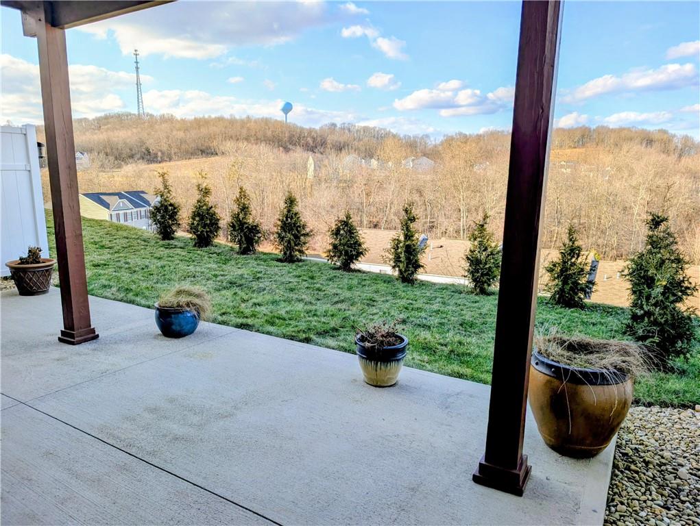146 Rylie Drive Harmony, PA 16037 - Photo 35 of 43 a view of a patio with lawn chairs and a floor to ceiling window