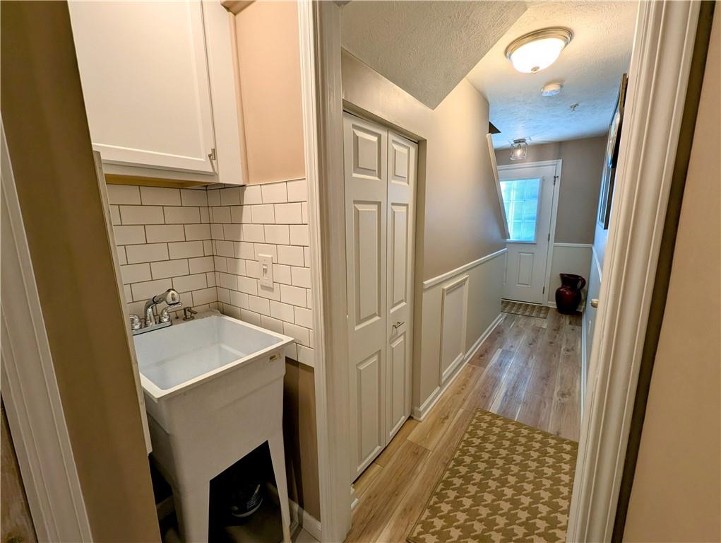 146 Rylie Drive Harmony, PA 16037 - Photo 4 of 43 a bathroom with a sink and a mirror