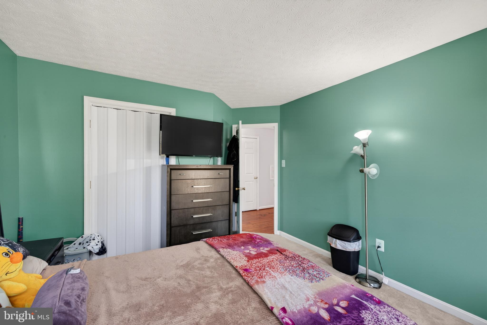 611 Hunting Ridge Drive Frederick, MD 21703 - Photo 32 of 50 a bedroom with a bed and a television
