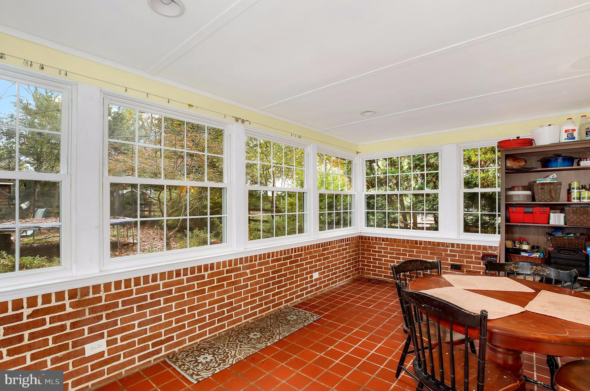 603 Carysbrook Road Baltimore, MD 21208 - Photo 14 of 30 a view of a dining room with furniture chandelier and wooden floor