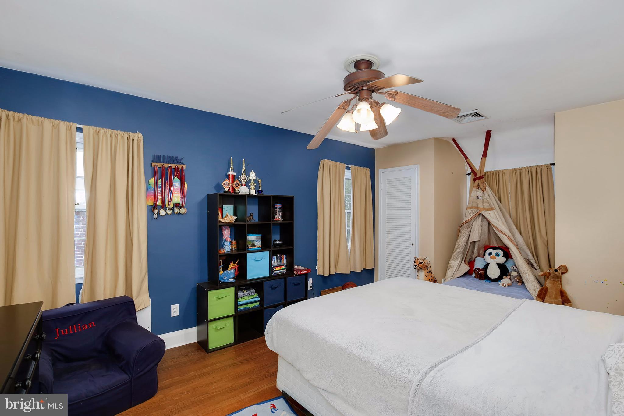 603 Carysbrook Road Baltimore, MD 21208 - Photo 18 of 30 a bedroom with a bed closet and a window