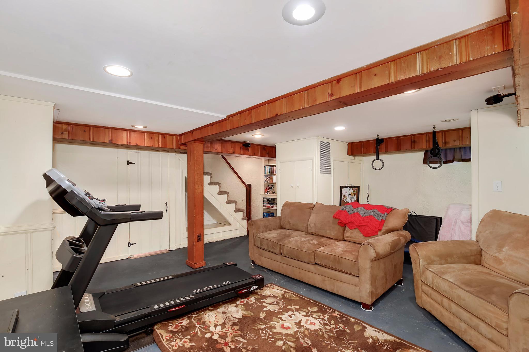 603 Carysbrook Road Baltimore, MD 21208 - Photo 24 of 30 a living room with furniture and a air conditioner vent