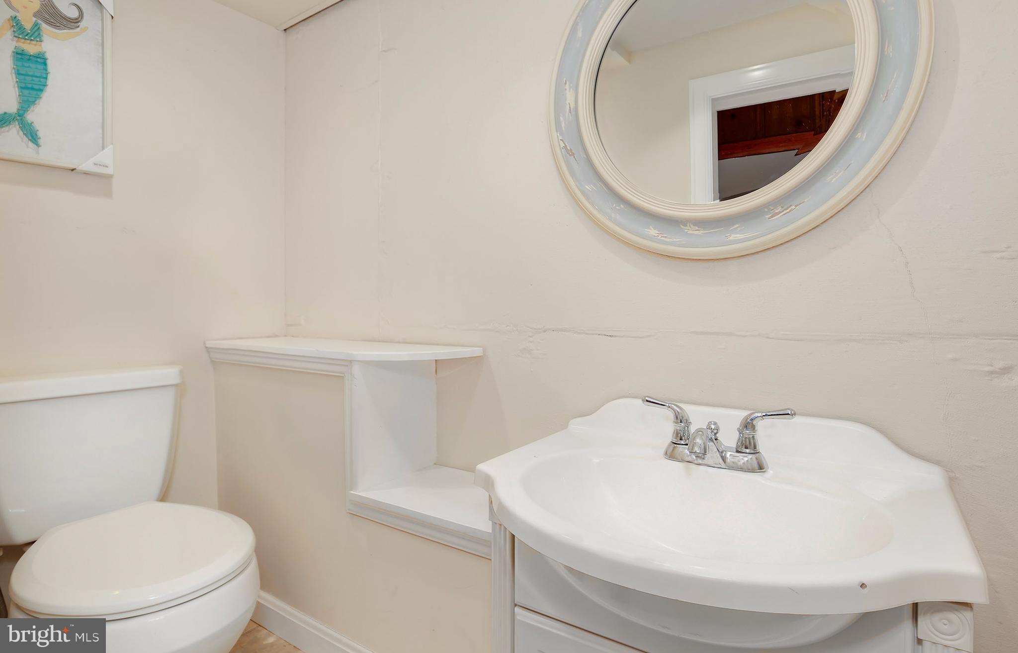 603 Carysbrook Road Baltimore, MD 21208 - Photo 26 of 30 a bathroom with a toilet and a sink