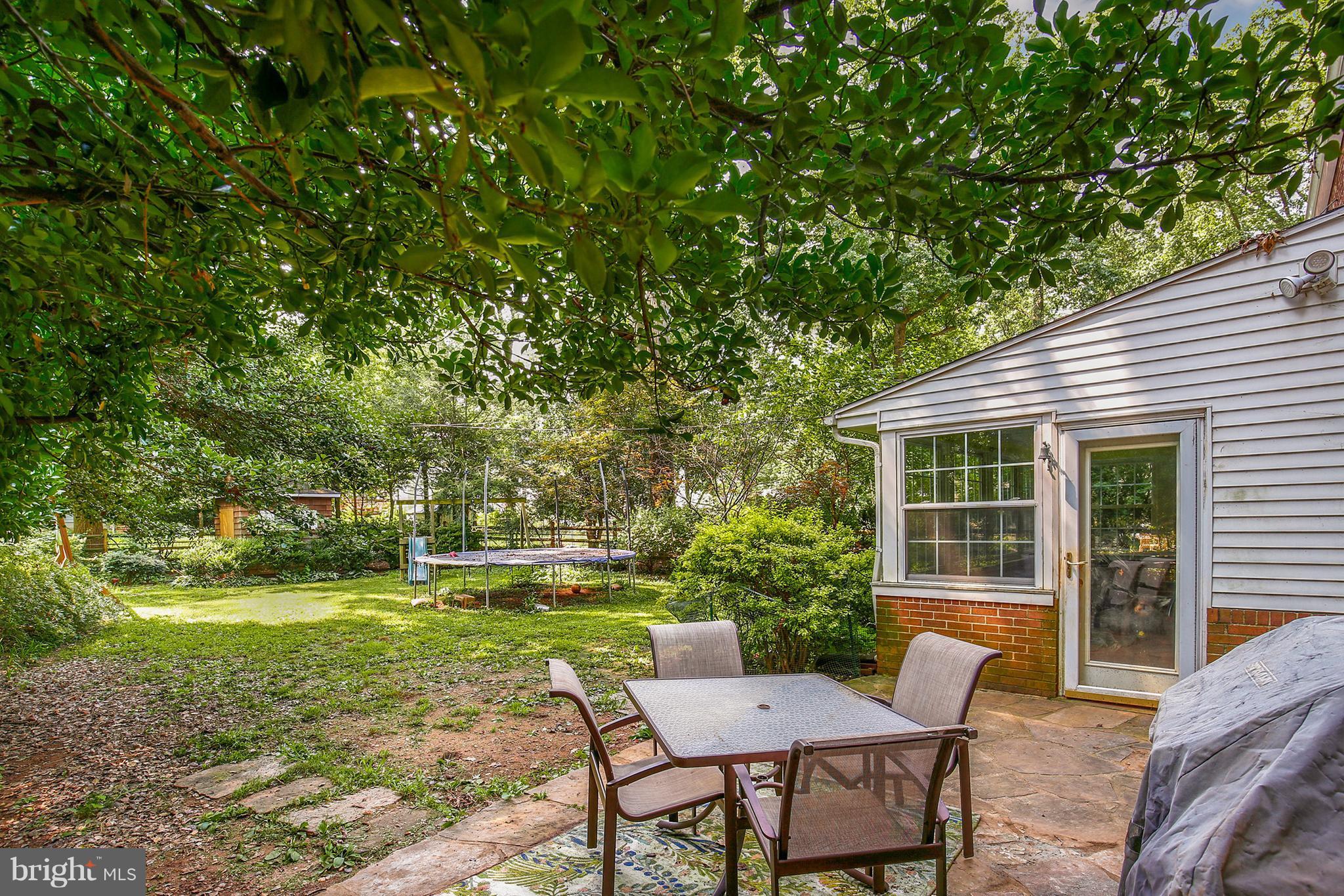 603 Carysbrook Road Baltimore, MD 21208 - Photo 28 of 30 a backyard of a house with yard and outdoor seating