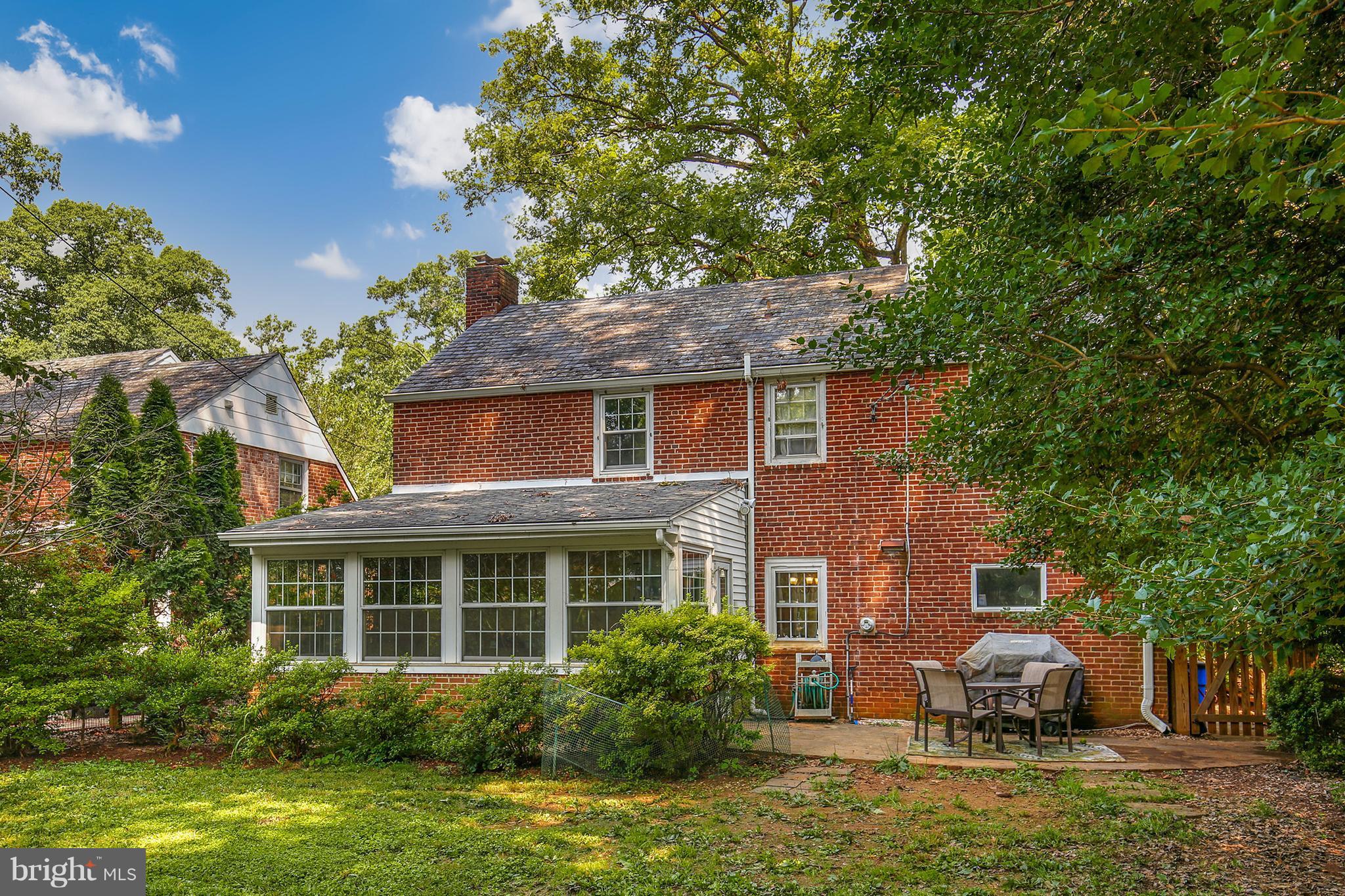 603 Carysbrook Road Baltimore, MD 21208 - Photo 29 of 30 a front view of a house with a garden and tree