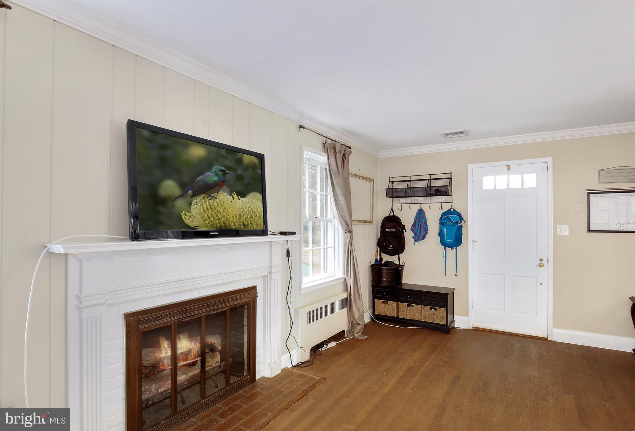 603 Carysbrook Road Baltimore, MD 21208 - Photo 5 of 30 a living room with furniture and a fireplace