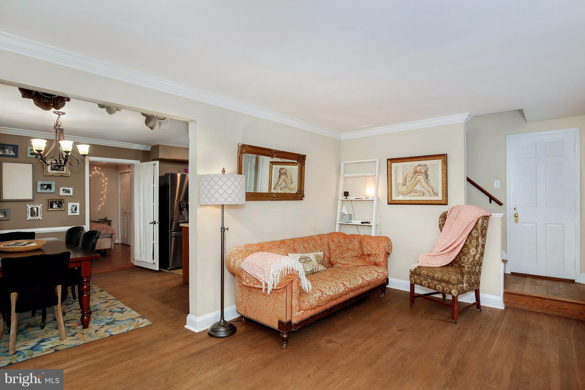 603 Carysbrook Road Baltimore, MD 21208 - Photo 6 of 30 a bedroom with a bed and a chair