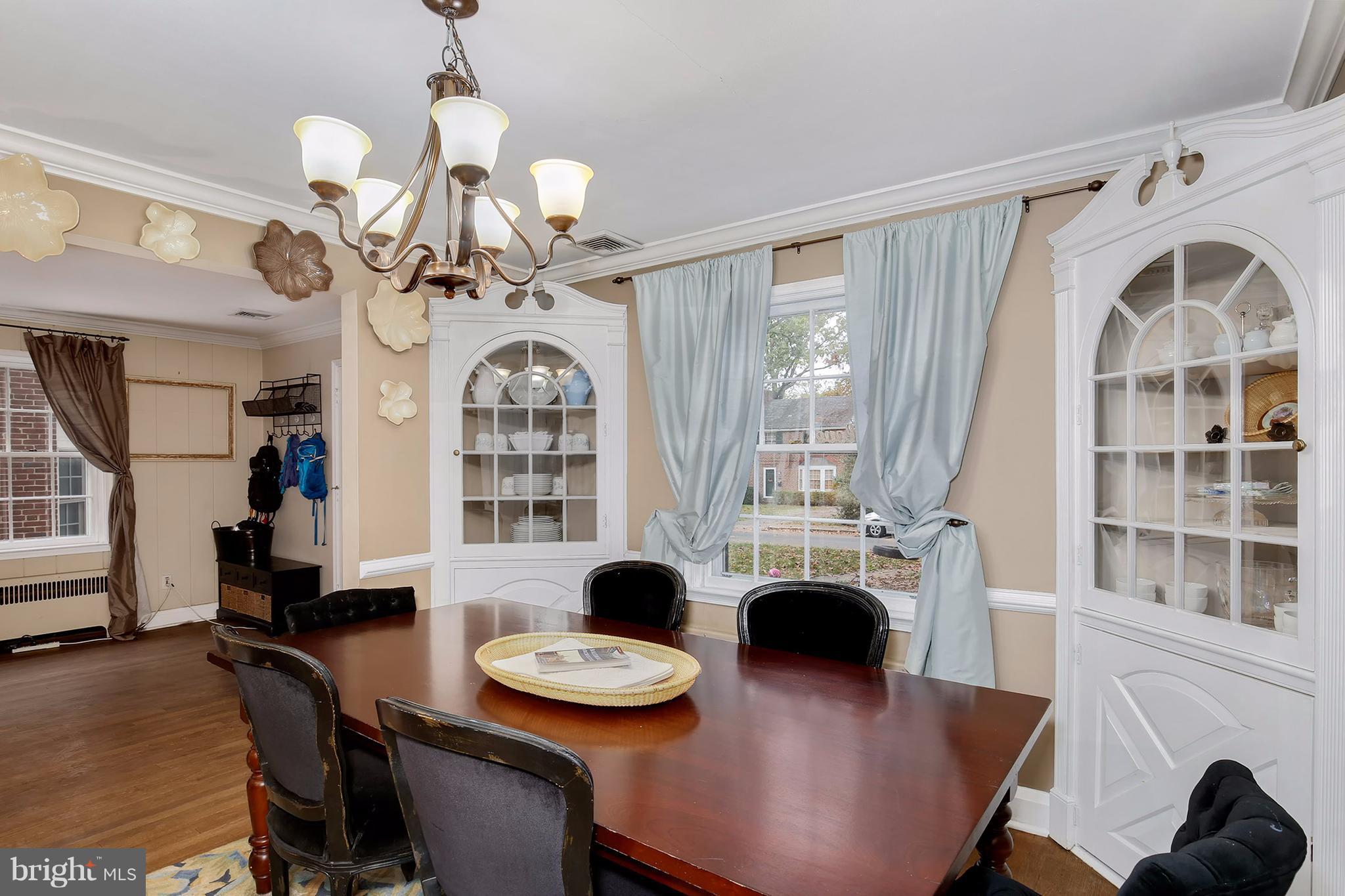 603 Carysbrook Road Baltimore, MD 21208 - Photo 7 of 30 a view of a dining room with furniture and chandelier