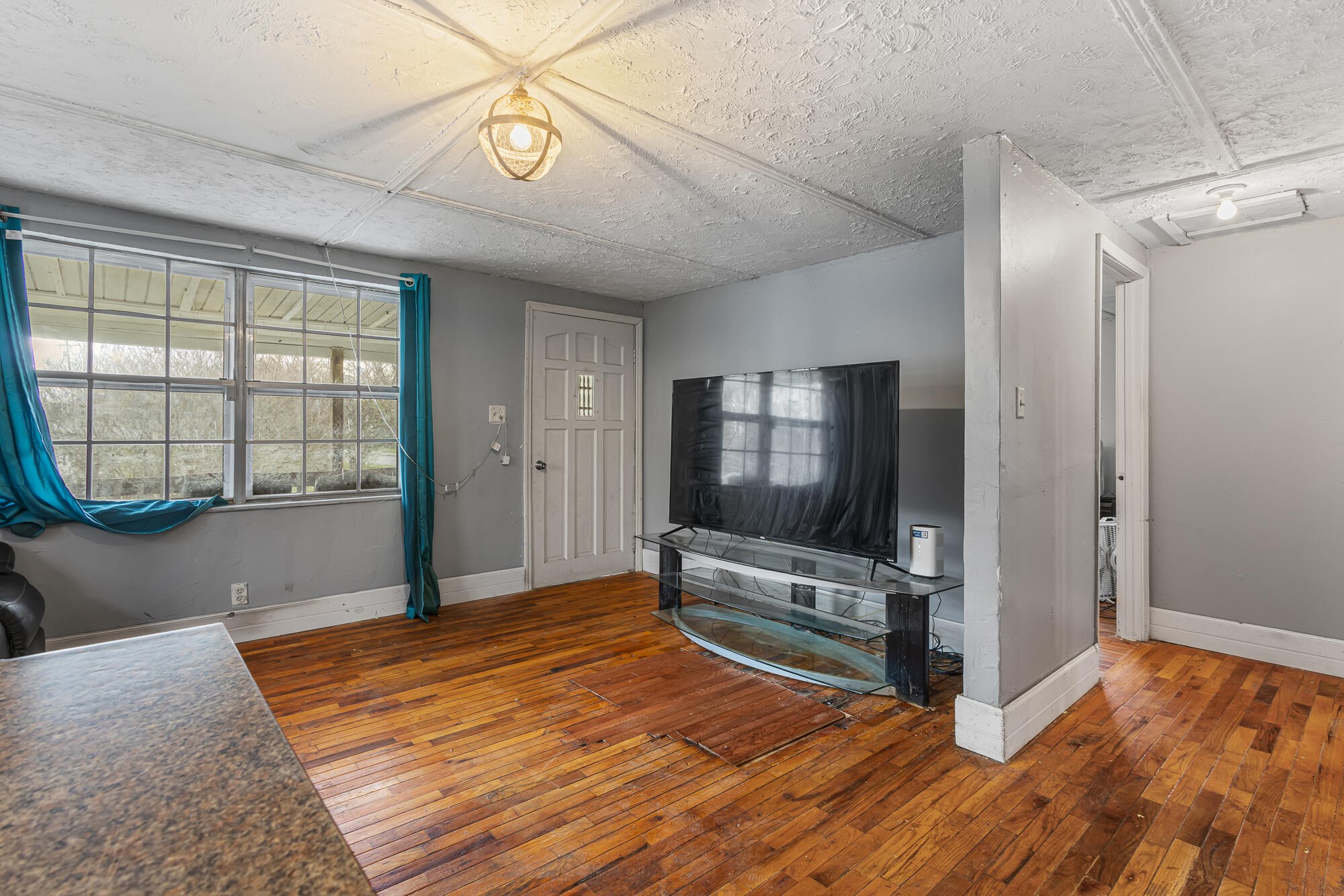 527 North Kilgore Street Athens, TN 37303 - Photo 7 of 13 a bedroom with wooden floor mirror and windows