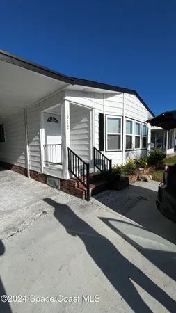 a front view of a house with yard