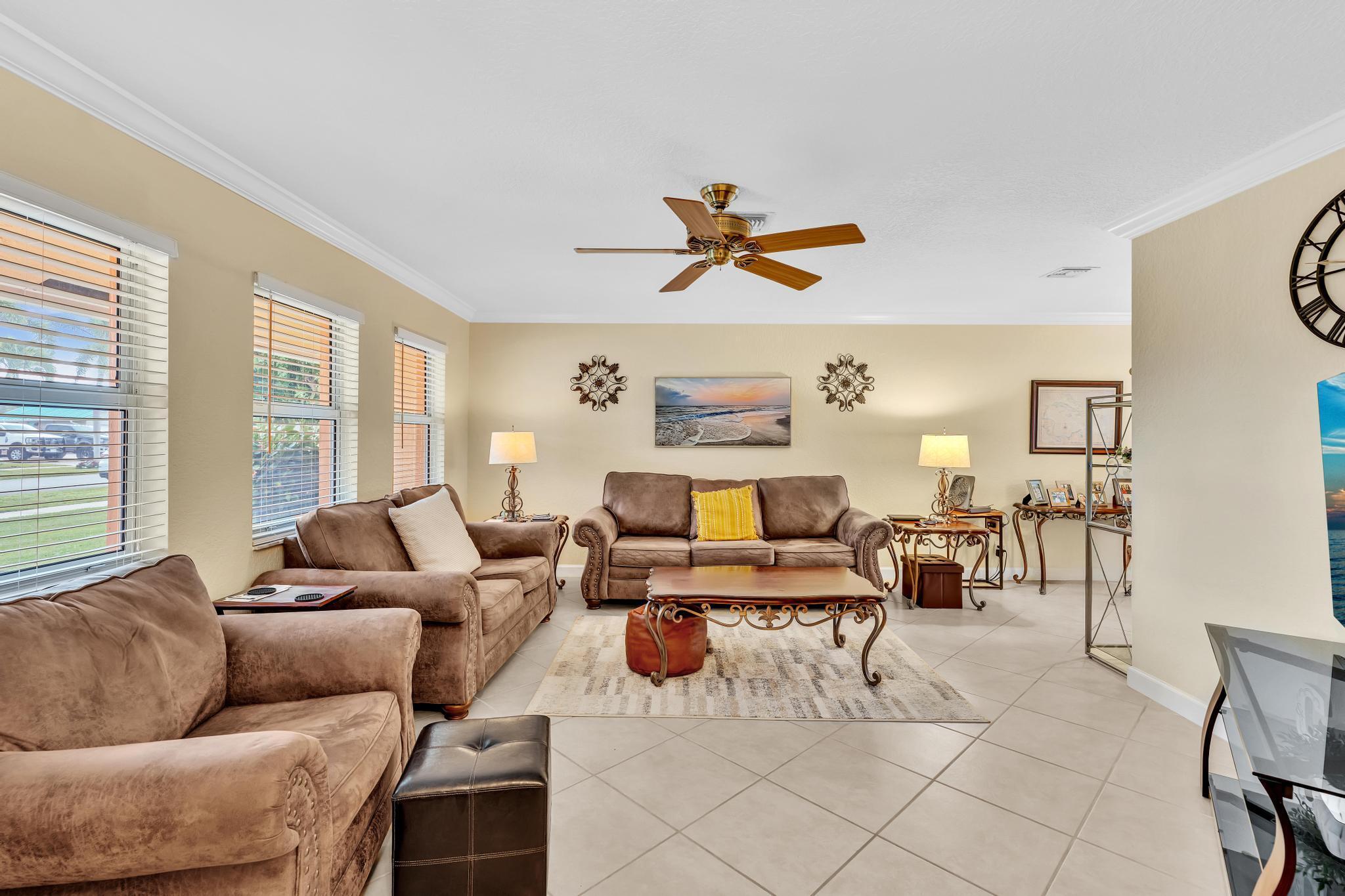 3106 Cormorant Road Delray Beach, FL 33444 - Photo 14 of 45 a living room with furniture and a large window