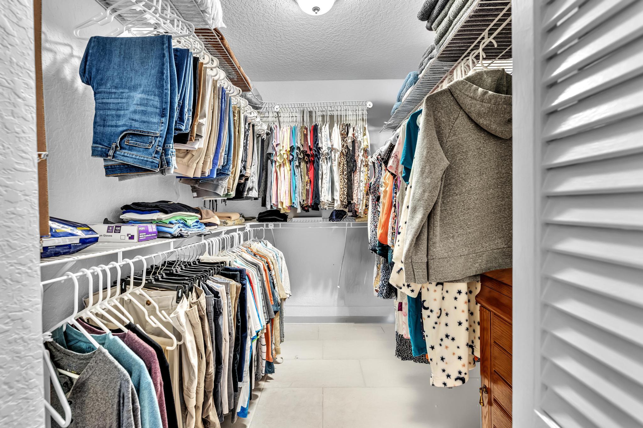 3106 Cormorant Road Delray Beach, FL 33444 - Photo 20 of 45 a view of walk in closet with clothes and shoes