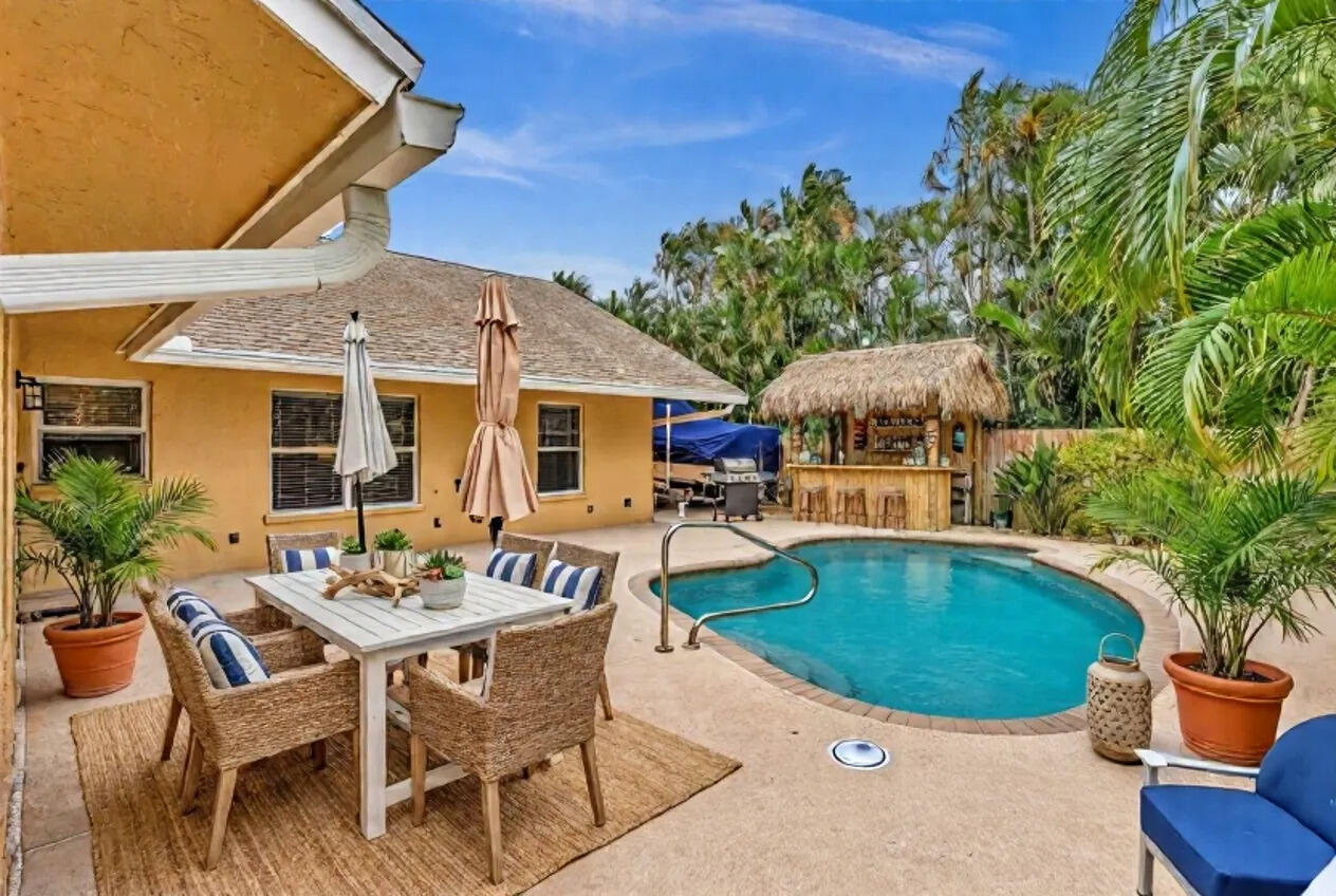3106 Cormorant Road Delray Beach, FL 33444 - Photo 3 of 45 an outdoor space with seating area and barbeque oven