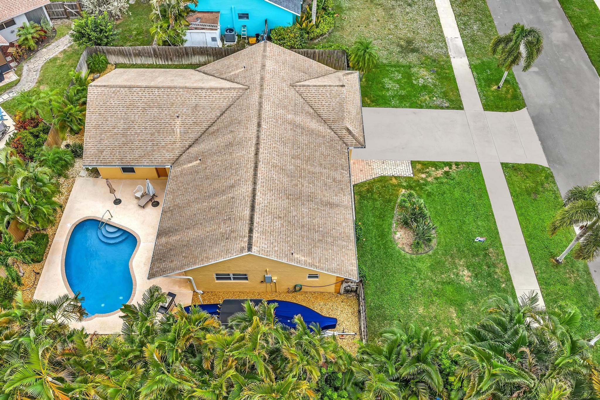 3106 Cormorant Road Delray Beach, FL 33444 - Photo 35 of 45 an aerial view of a house with a swimming pool