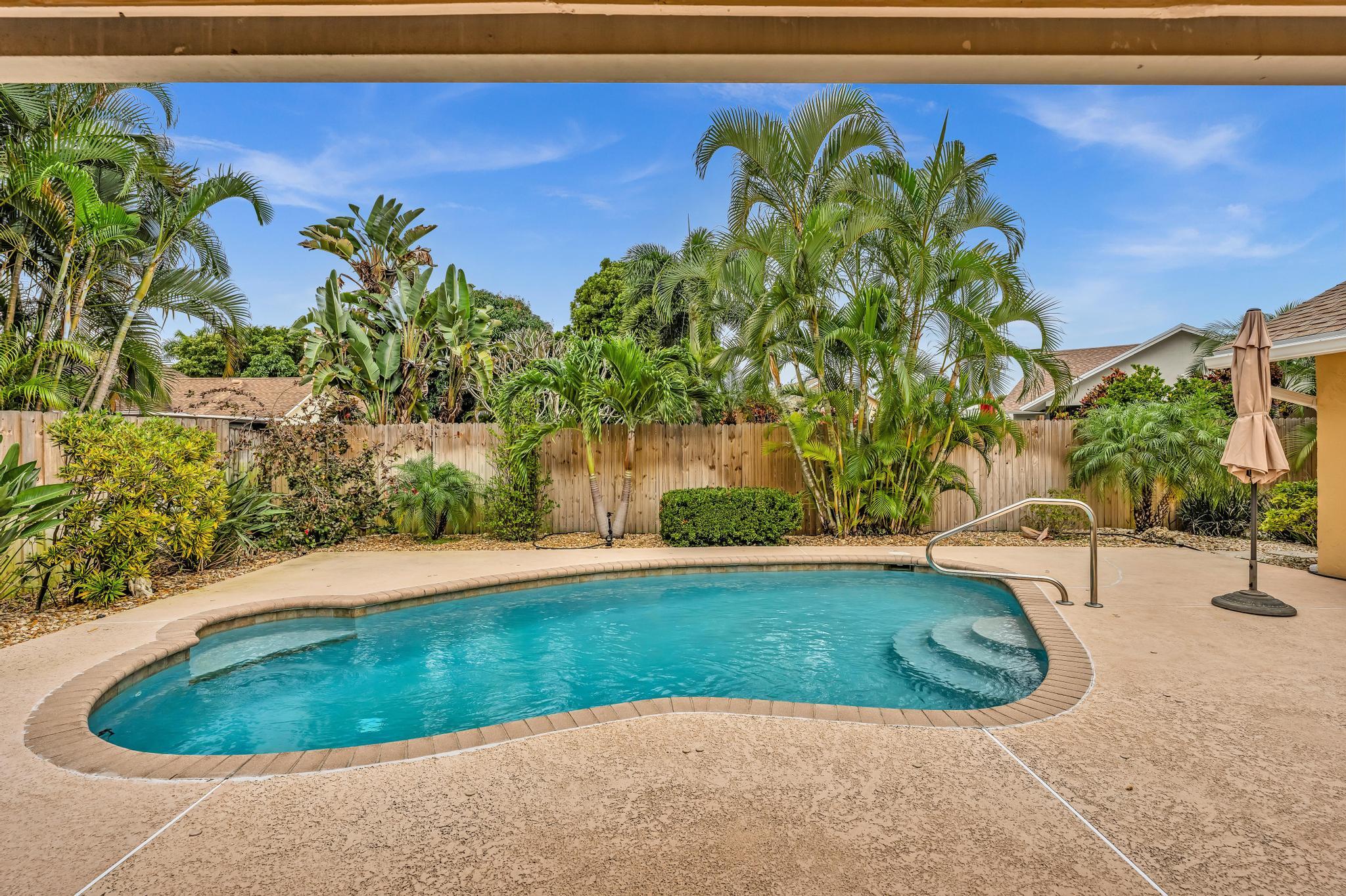 3106 Cormorant Road Delray Beach, FL 33444 - Photo 4 of 45 a view of a backyard