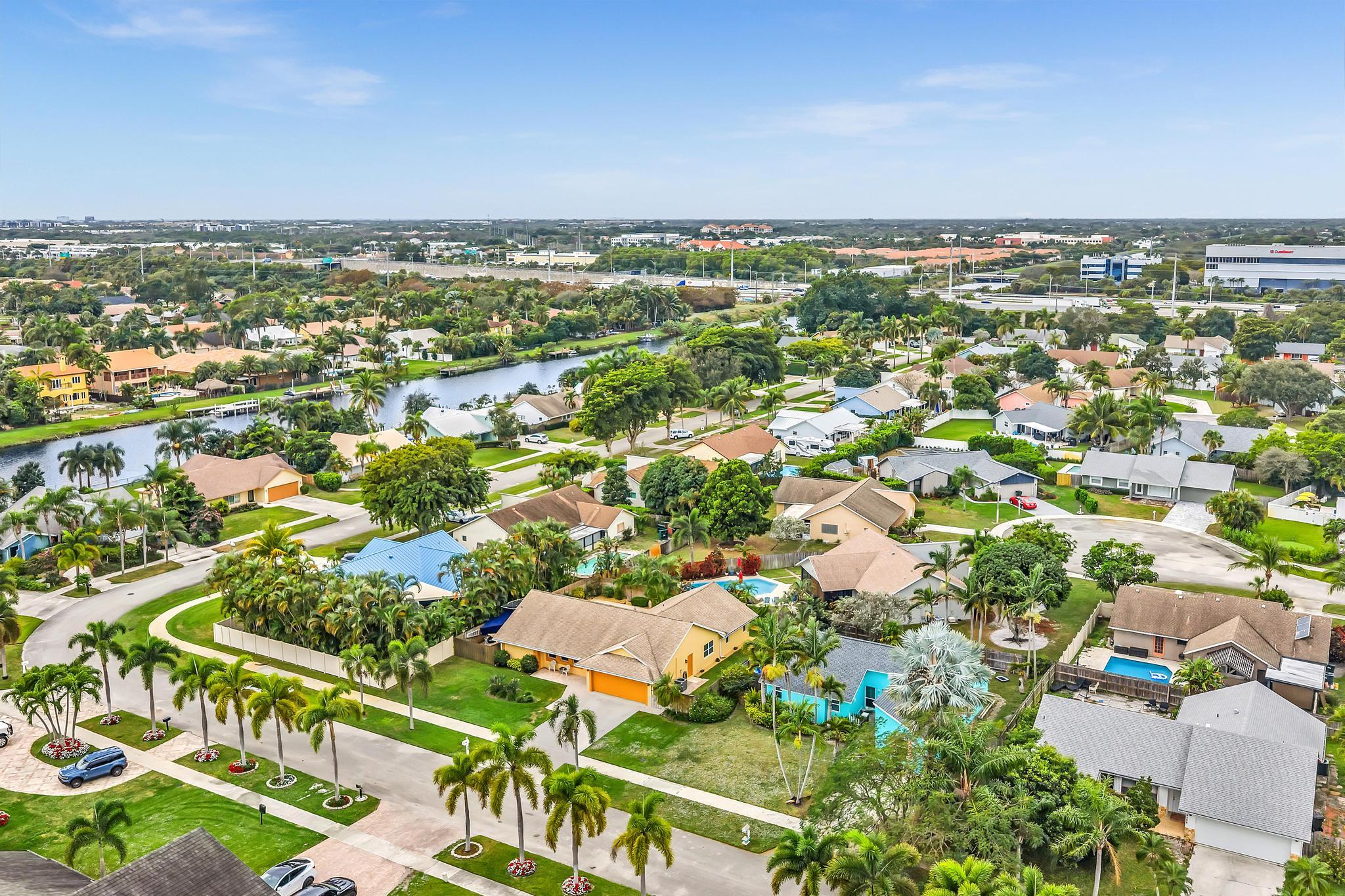 3106 Cormorant Road Delray Beach, FL 33444 - Photo 37 of 45 an aerial view of residential building and trees around