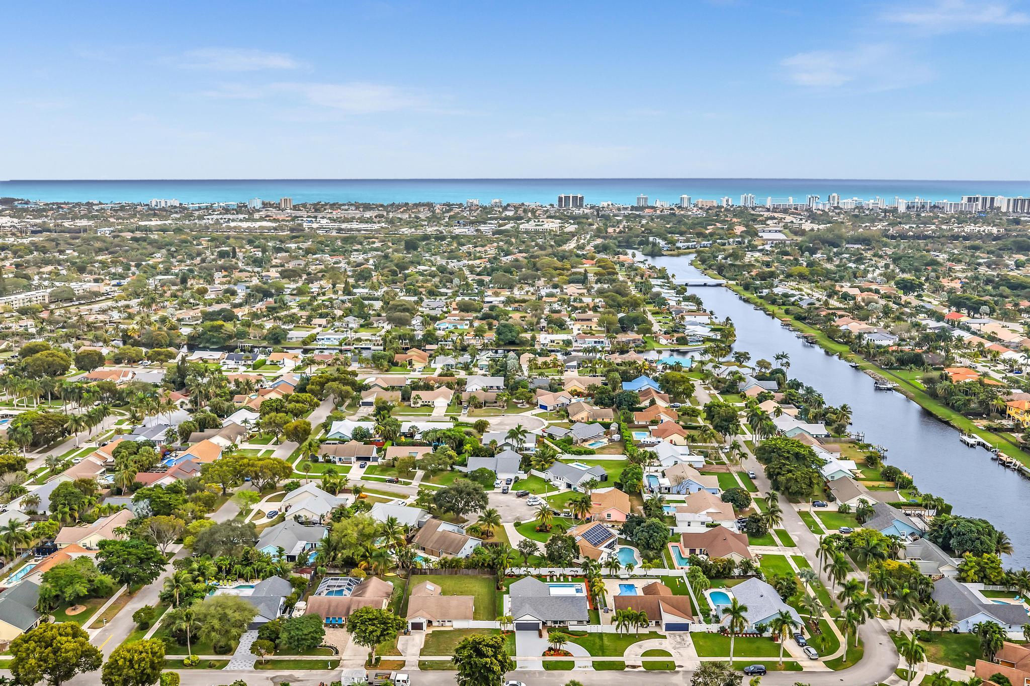 3106 Cormorant Road Delray Beach, FL 33444 - Photo 40 of 45 an aerial view of residential building and trees