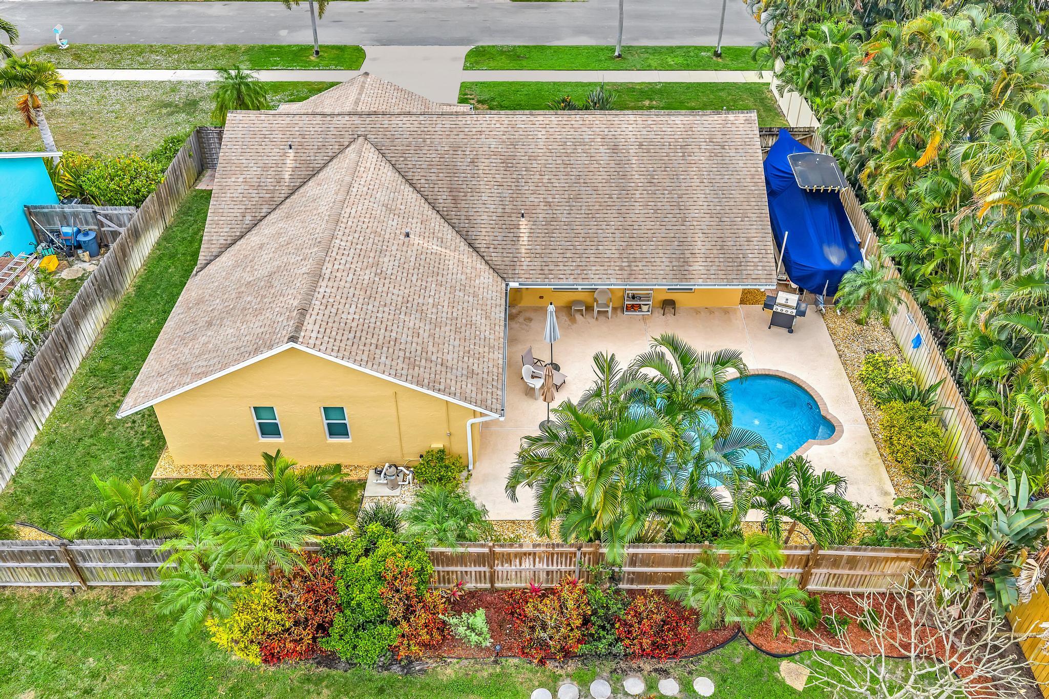 3106 Cormorant Road Delray Beach, FL 33444 - Photo 5 of 45 a view of swimming pool in front of house