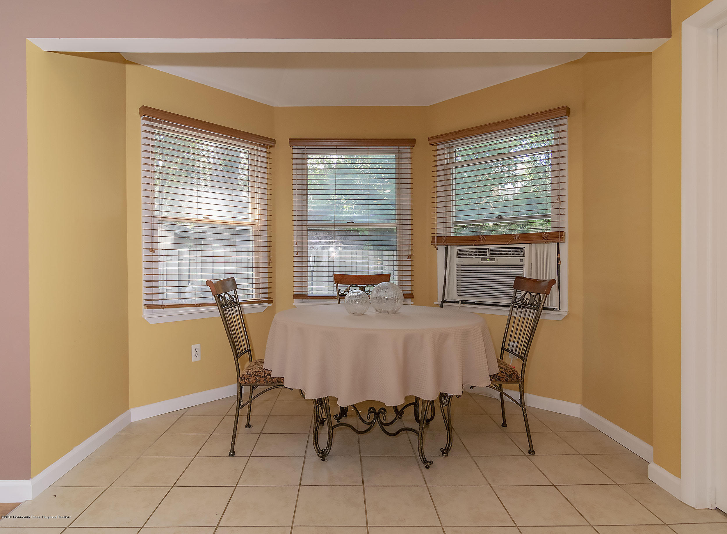 2104 River Road Point Pleasant, NJ 08742 - Photo 12 of 35 a view of a dining room with furniture and a window