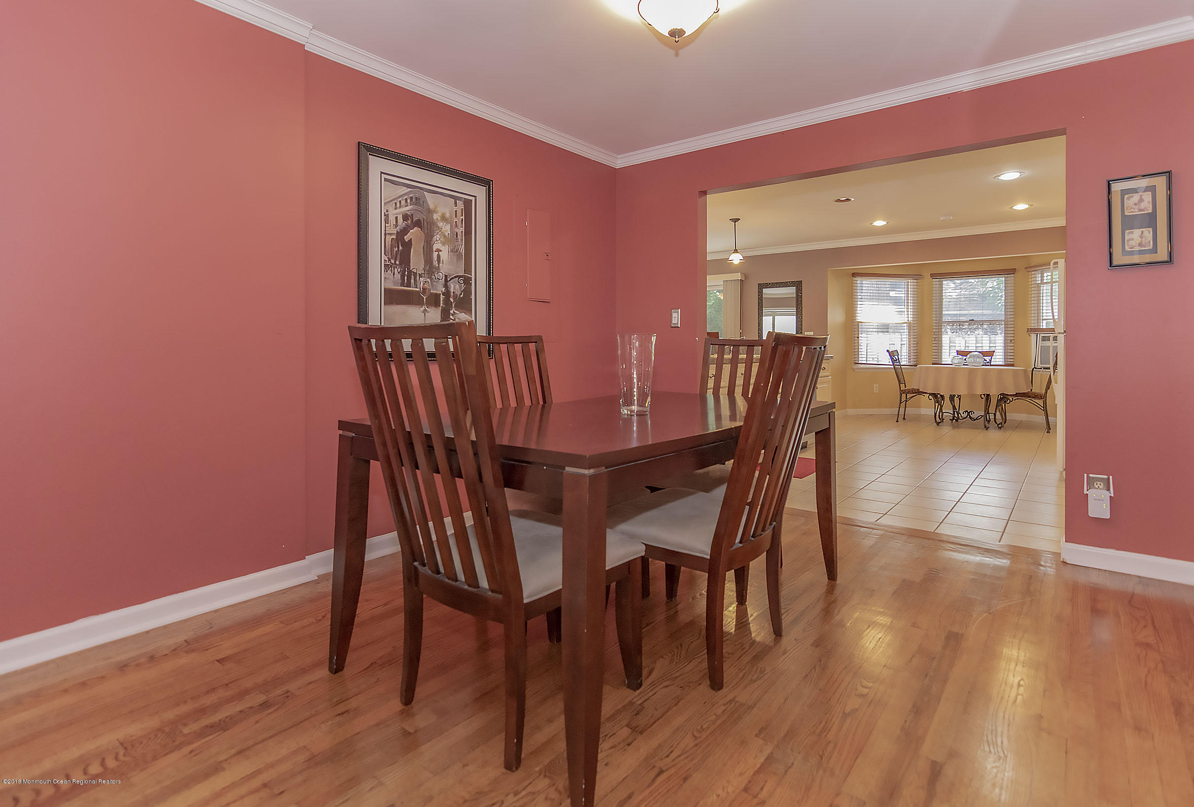2104 River Road Point Pleasant, NJ 08742 - Photo 14 of 35 a view of a dining room with furniture and wooden floor