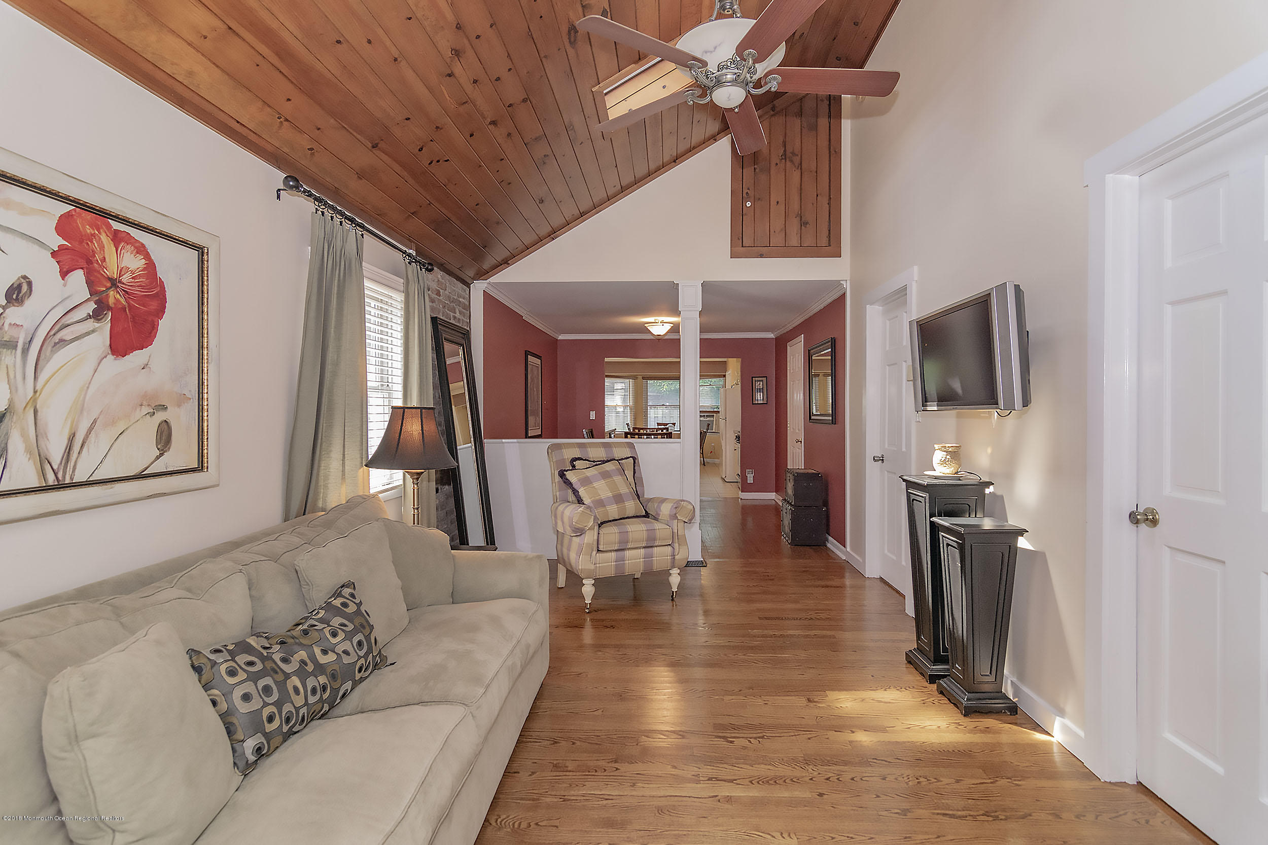2104 River Road Point Pleasant, NJ 08742 - Photo 16 of 35 a living room with furniture and a fireplace