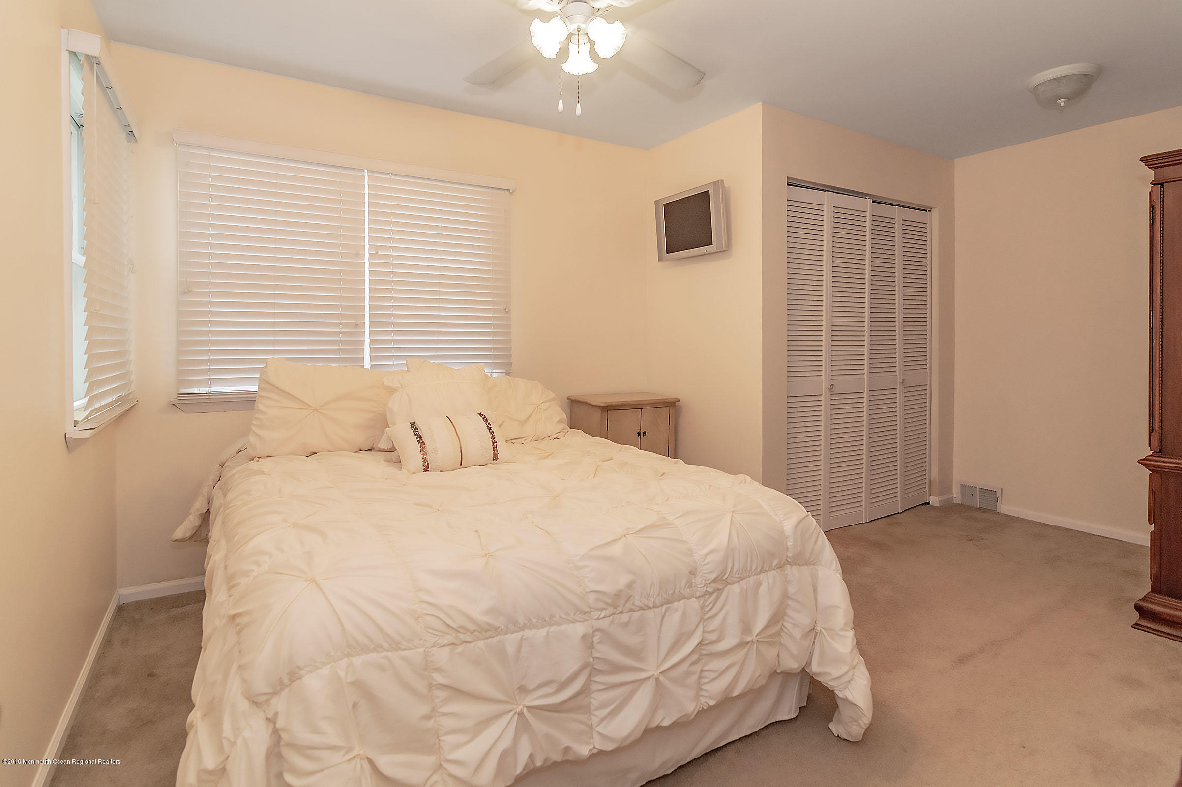 2104 River Road Point Pleasant, NJ 08742 - Photo 19 of 35 a large white bed in a white room