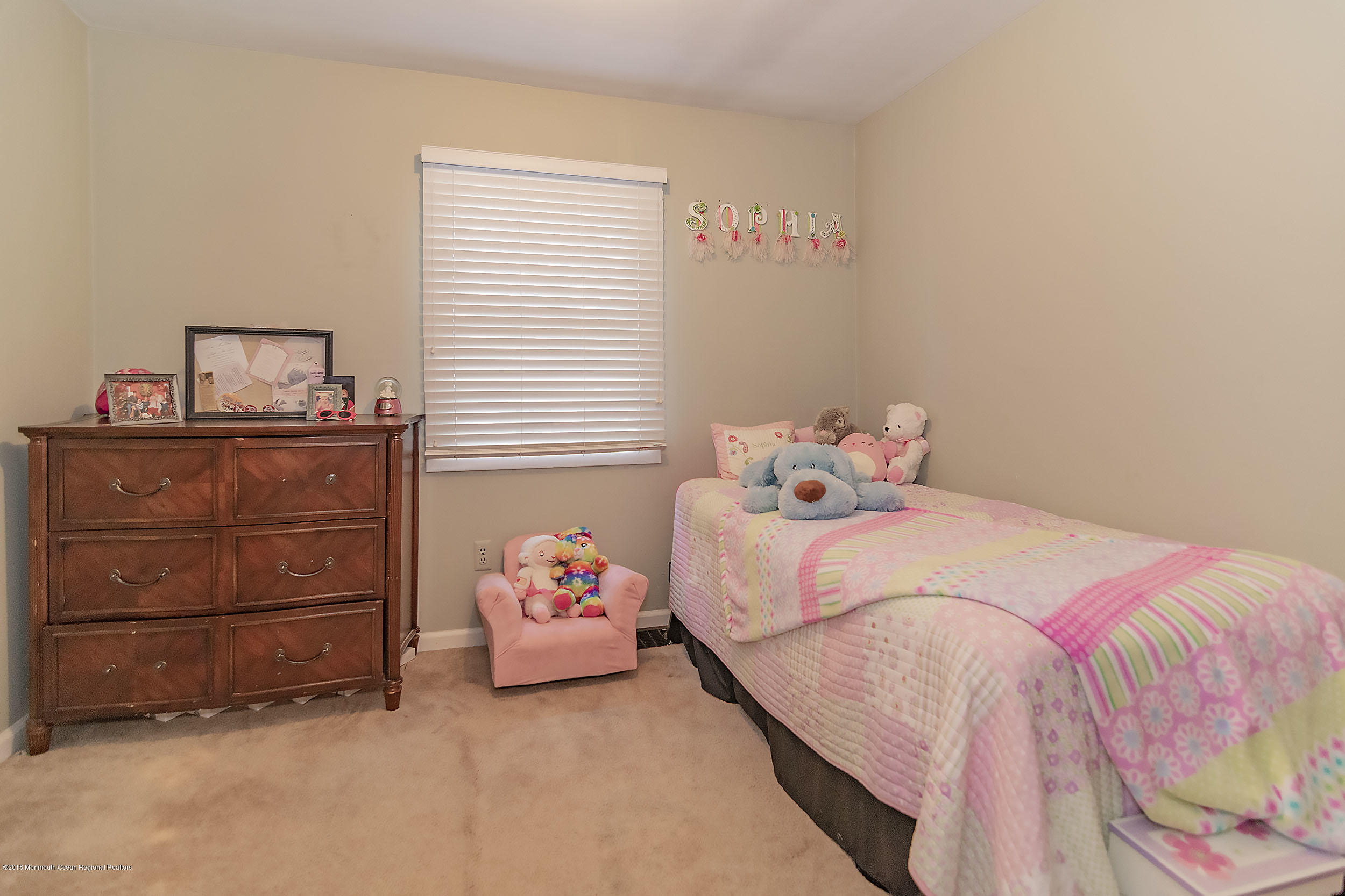 2104 River Road Point Pleasant, NJ 08742 - Photo 21 of 35 a bedroom with a bed and a window