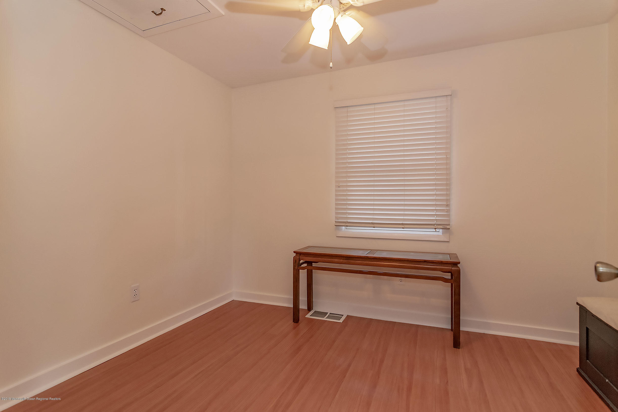 2104 River Road Point Pleasant, NJ 08742 - Photo 22 of 35 a view of wooden floor and windows in a room