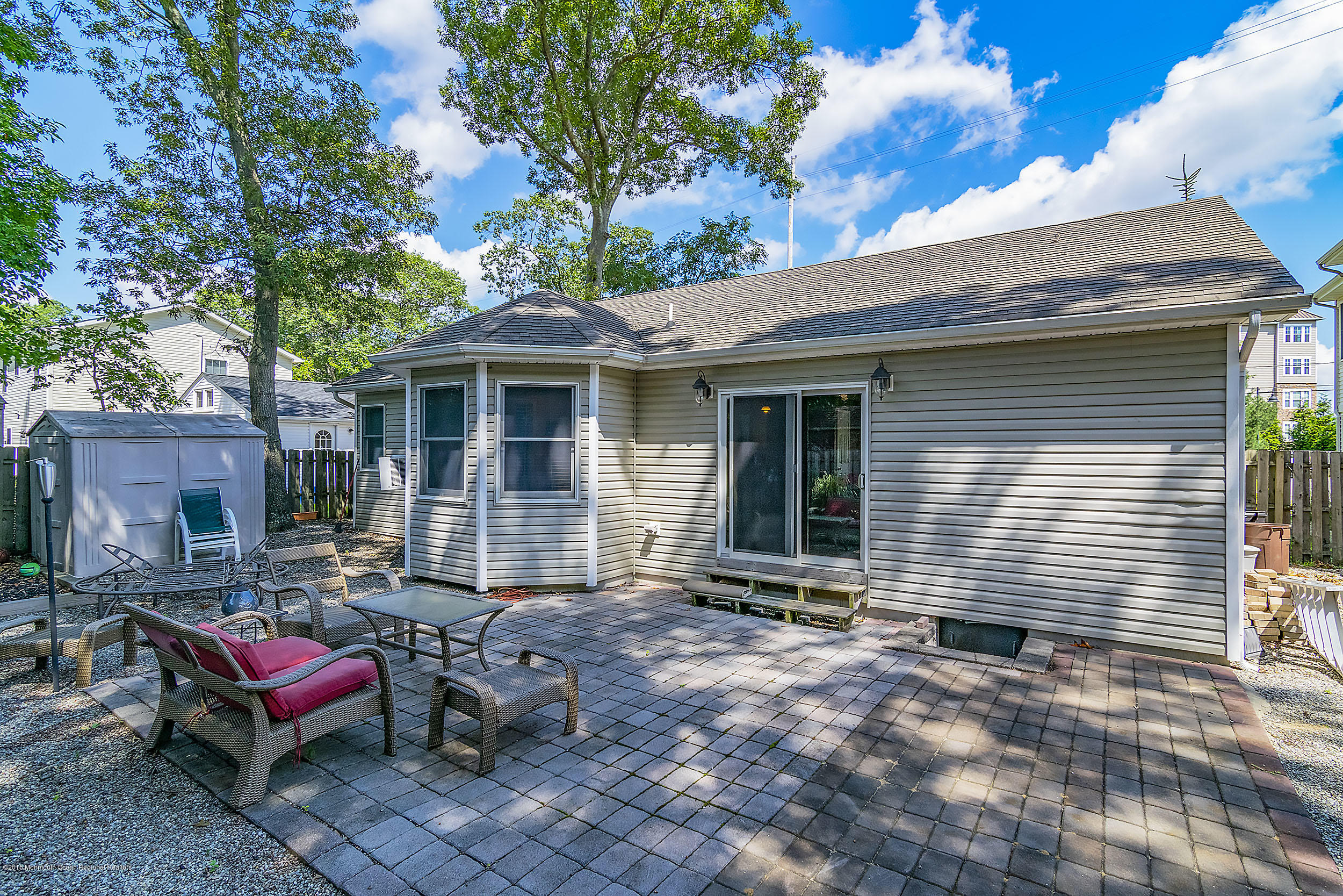 2104 River Road Point Pleasant, NJ 08742 - Photo 23 of 35 a backyard of a house with outdoor seating