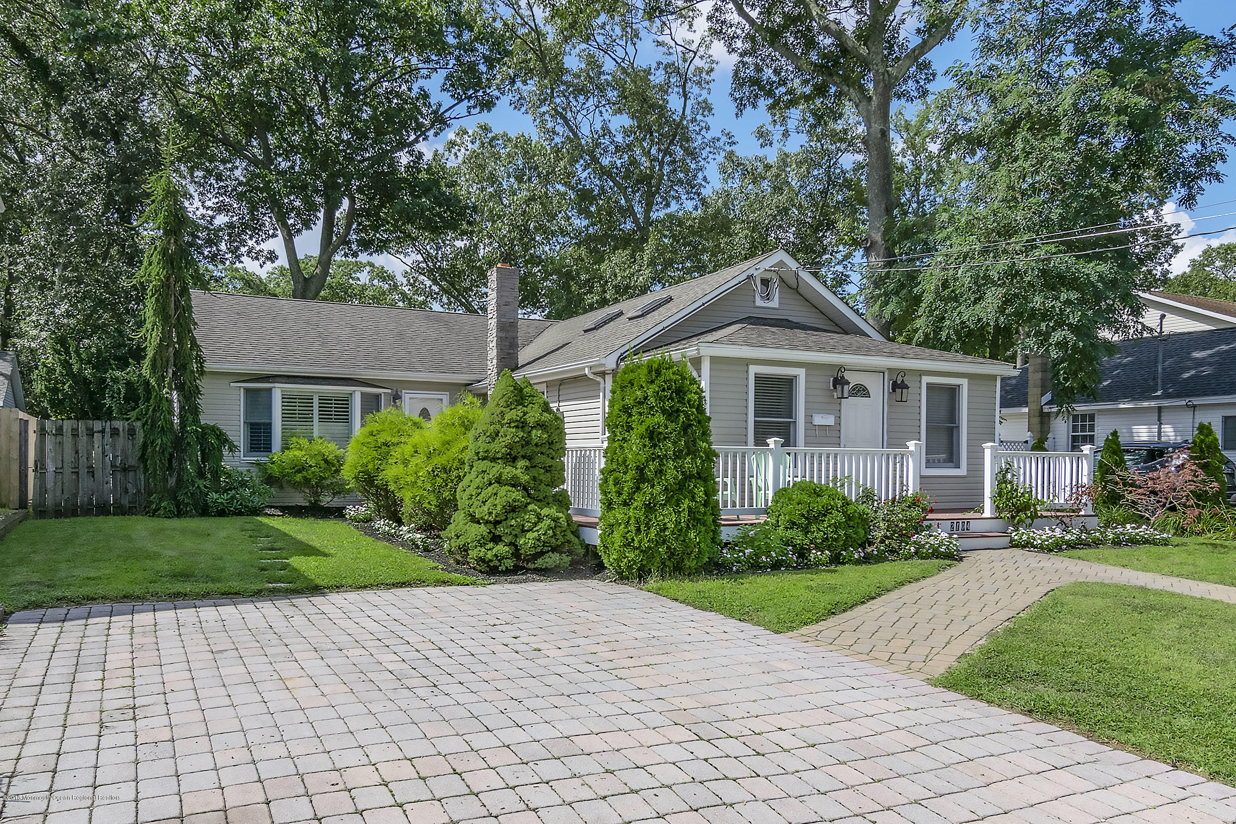 2104 River Road Point Pleasant, NJ 08742 - Photo 27 of 35 a front view of a house with a yard