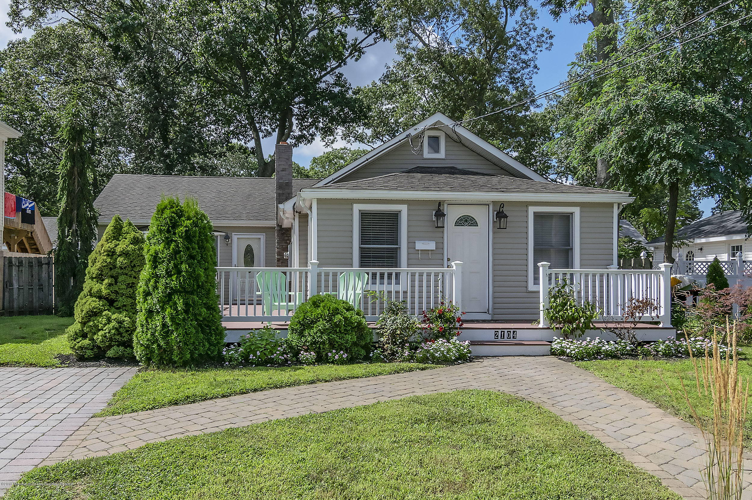 2104 River Road Point Pleasant, NJ 08742 - Photo 28 of 35 a front view of a house with garden