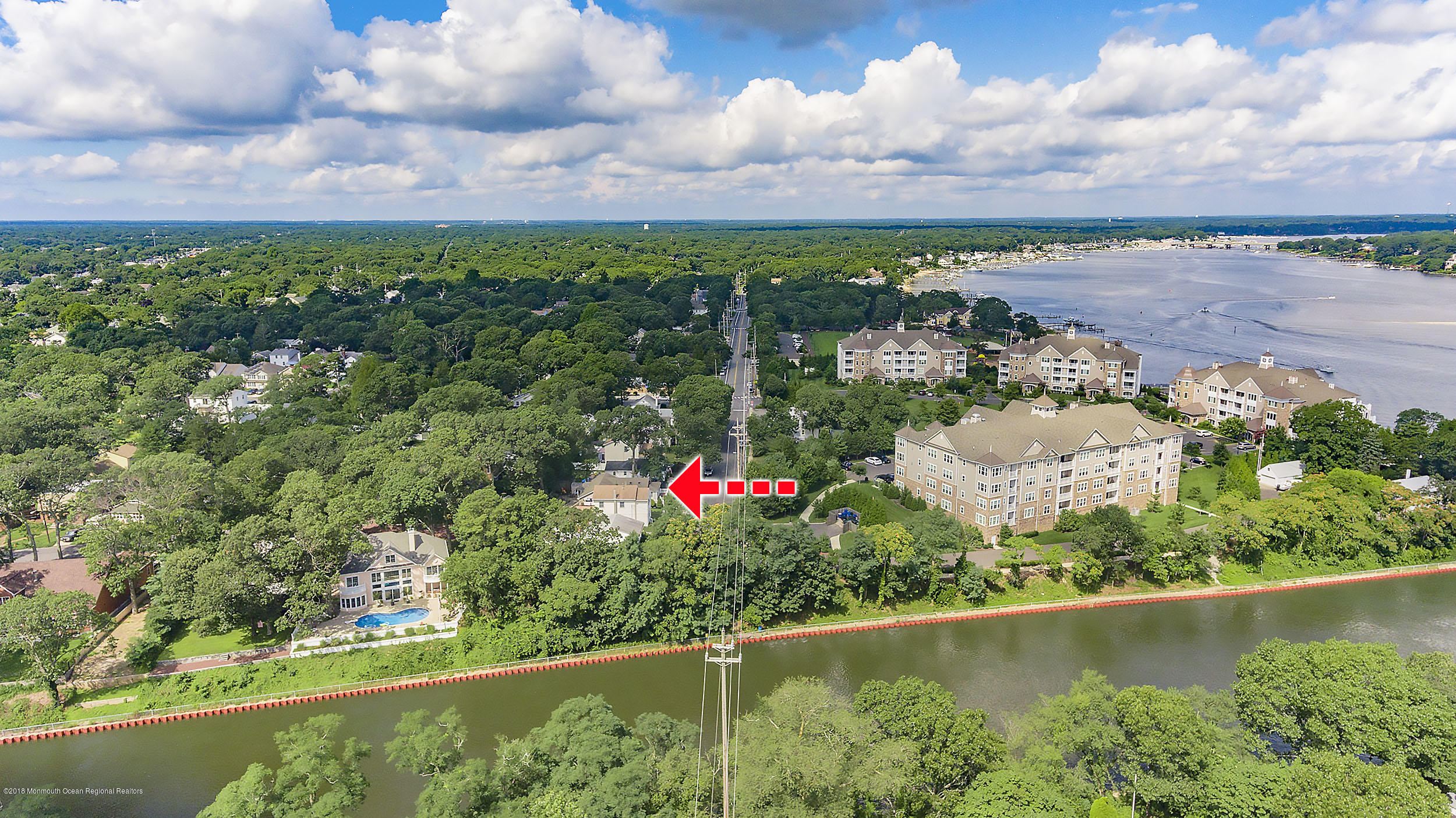 2104 River Road Point Pleasant, NJ 08742 - Photo 31 of 35 an aerial view of a house with a yard and lake view in back