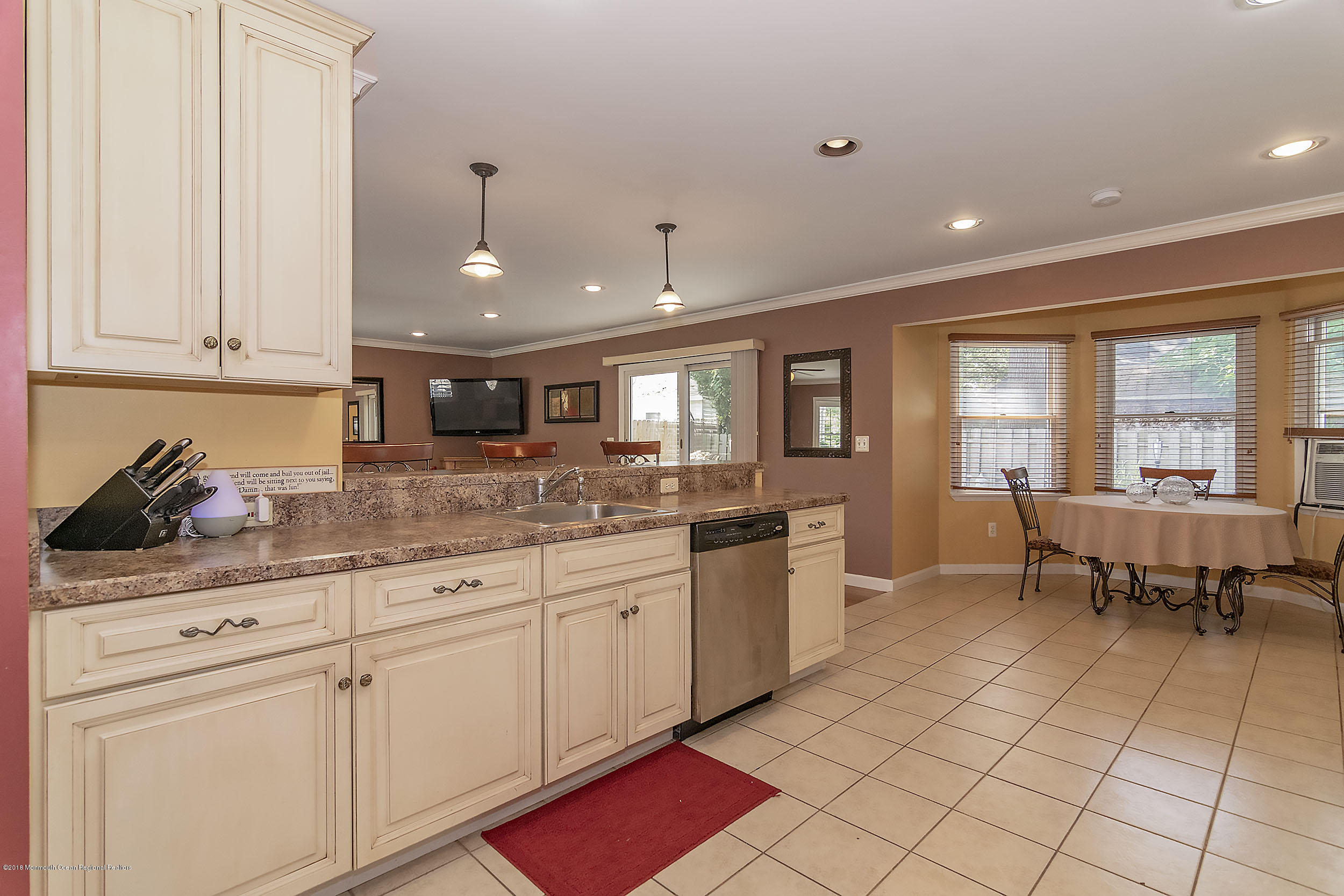 2104 River Road Point Pleasant, NJ 08742 - Photo 7 of 35 a kitchen with granite countertop a stove a sink and a refrigerator
