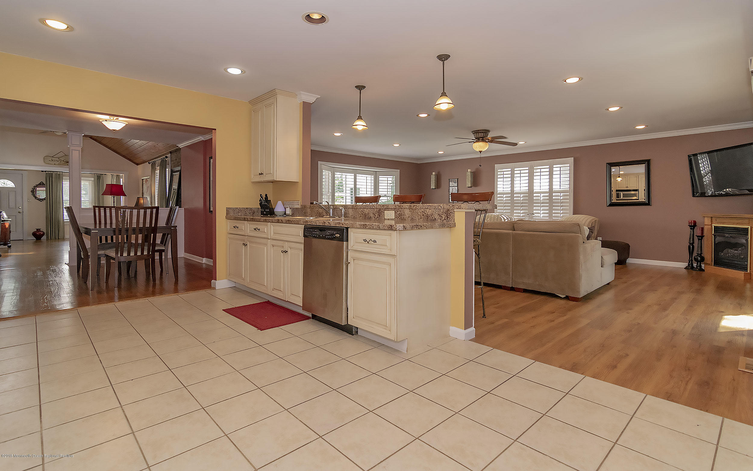 2104 River Road Point Pleasant, NJ 08742 - Photo 9 of 35 a kitchen with stainless steel appliances kitchen island granite countertop a sink and cabinets