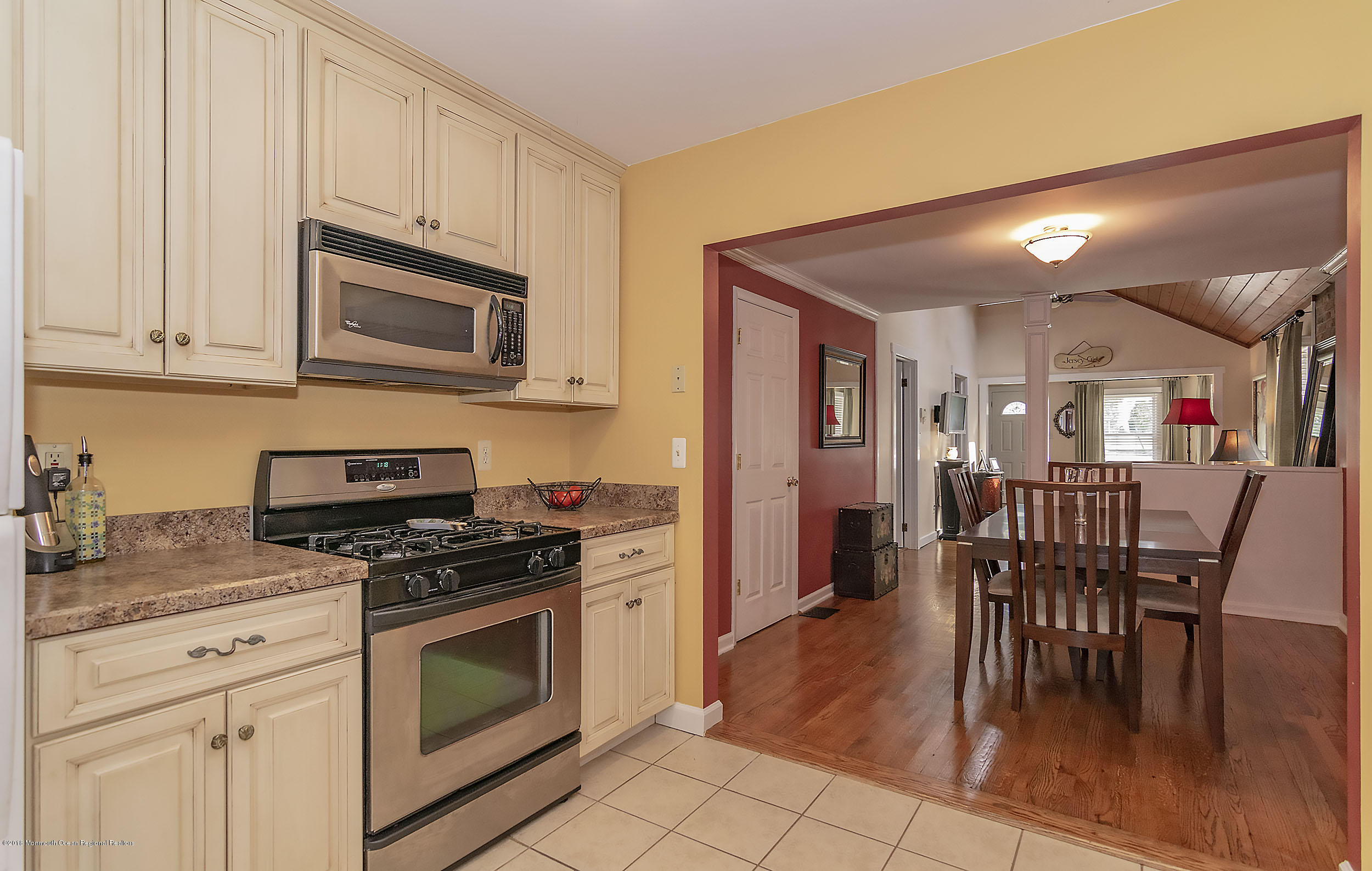 2104 River Road Point Pleasant, NJ 08742 - Photo 10 of 35 a kitchen with stainless steel appliances granite countertop a stove a sink a microwave and a refrigerator