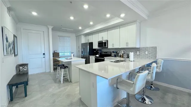a kitchen that has a table and chairs in it