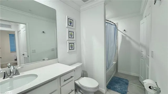 a bathroom with a sink toilet vanity and shower