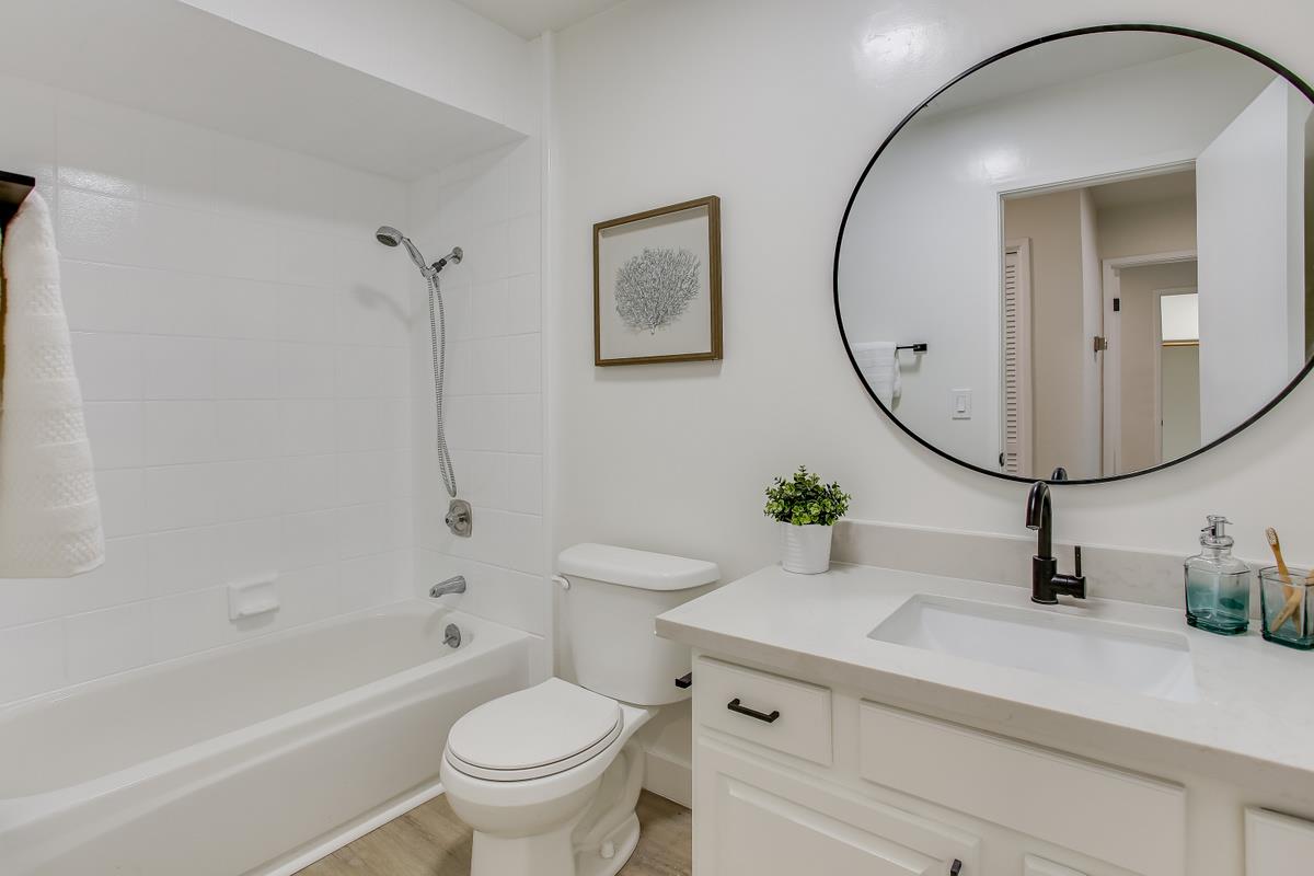 3705 Terstena Place, Unit 201 Santa Clara, CA 95051 - Photo 16 of 25 a bathroom with a sink a toilet and a mirror