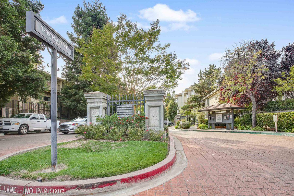 3705 Terstena Place, Unit 201 Santa Clara, CA 95051 - Photo 22 of 25 a view of a white house in a big yard with palm trees