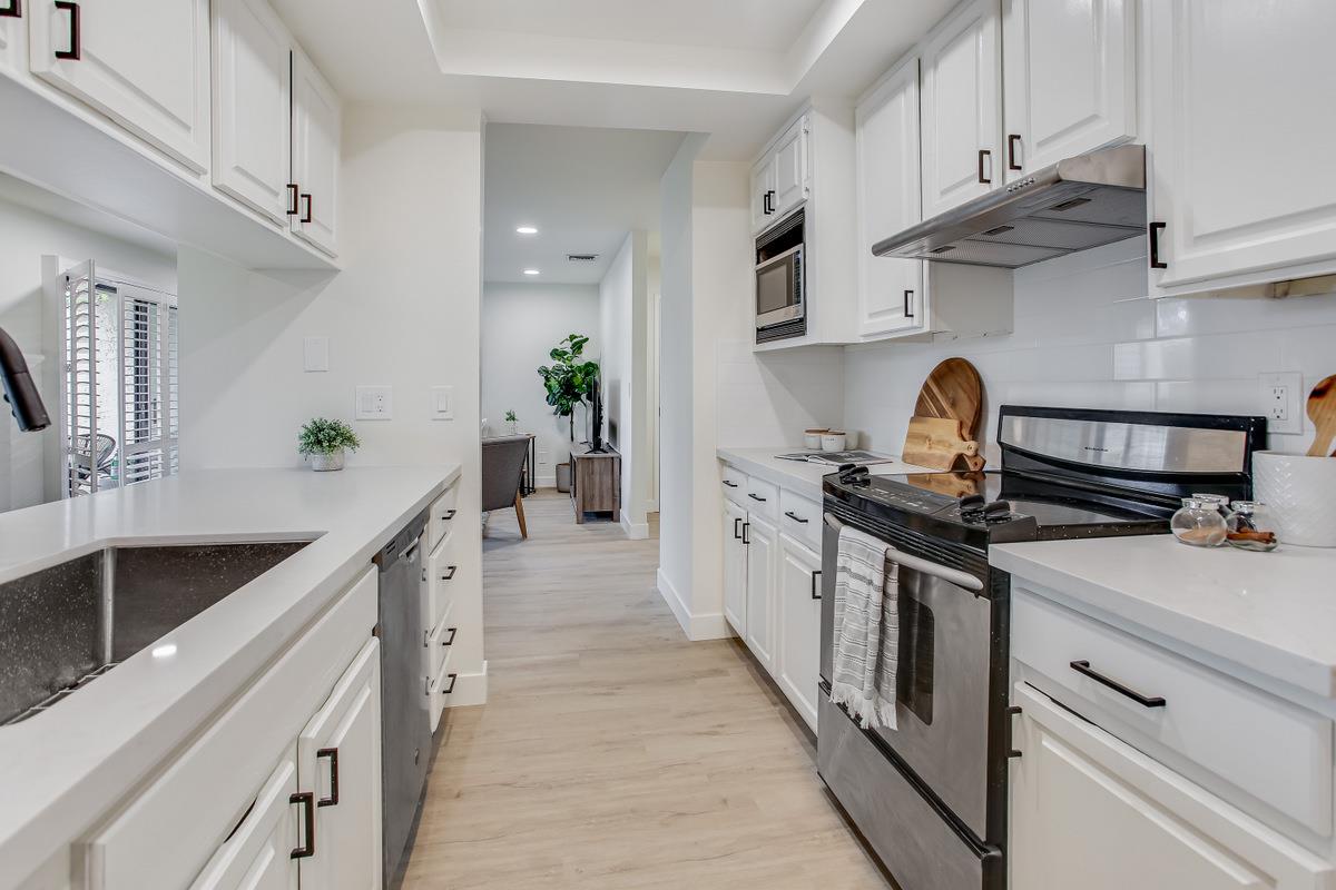 3705 Terstena Place, Unit 201 Santa Clara, CA 95051 - Photo 6 of 25 a kitchen with stainless steel appliances a sink stove and cabinets