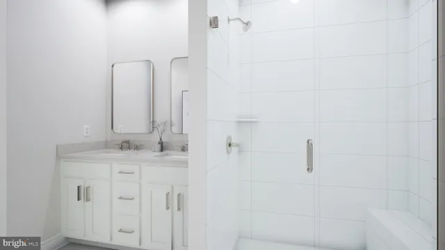 a bathroom with a granite countertop shower and a sink