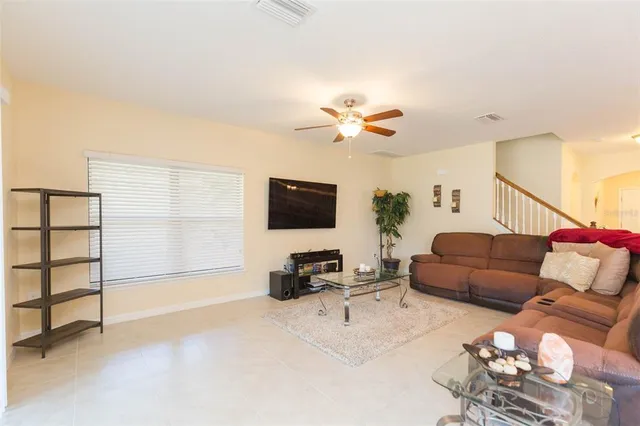 a kitchen with stainless steel appliances granite countertop a sink refrigerator and cabinets