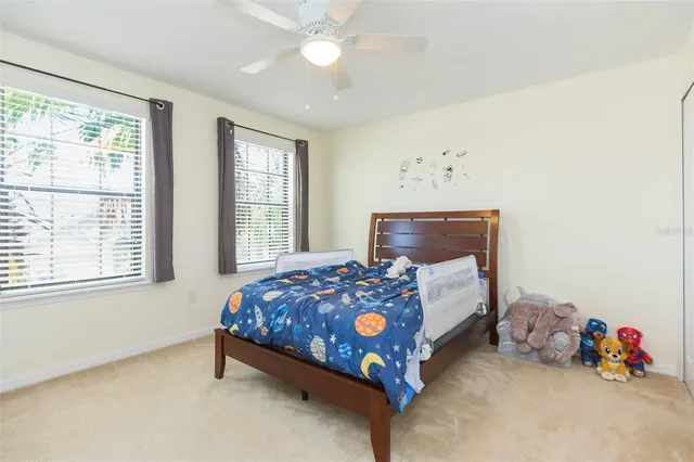 a view of walk in closet with clothes