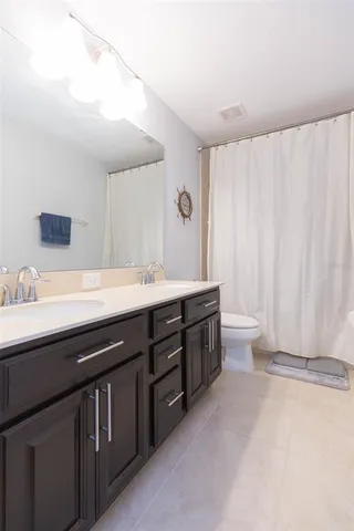 a bathroom with a shower and a bath tub