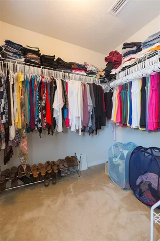 a living room with furniture and a ceiling fan