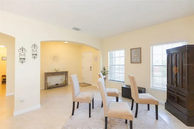 a view of a dining room with furniture window and outside view