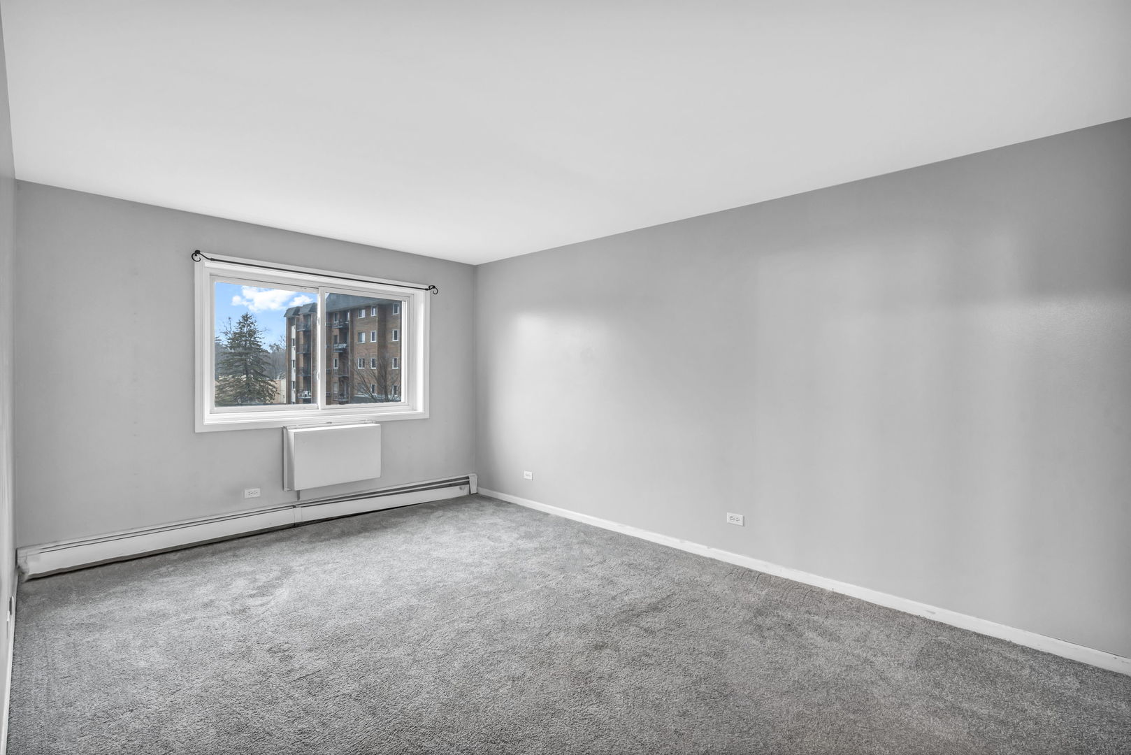 4721 St Joseph Creek Road, Unit 3H Lisle, IL 60532 - Photo 11 of 17 an empty room with windows
